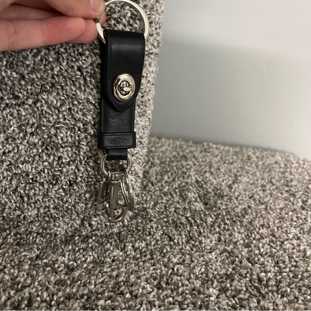 Black and silver Coach keychain